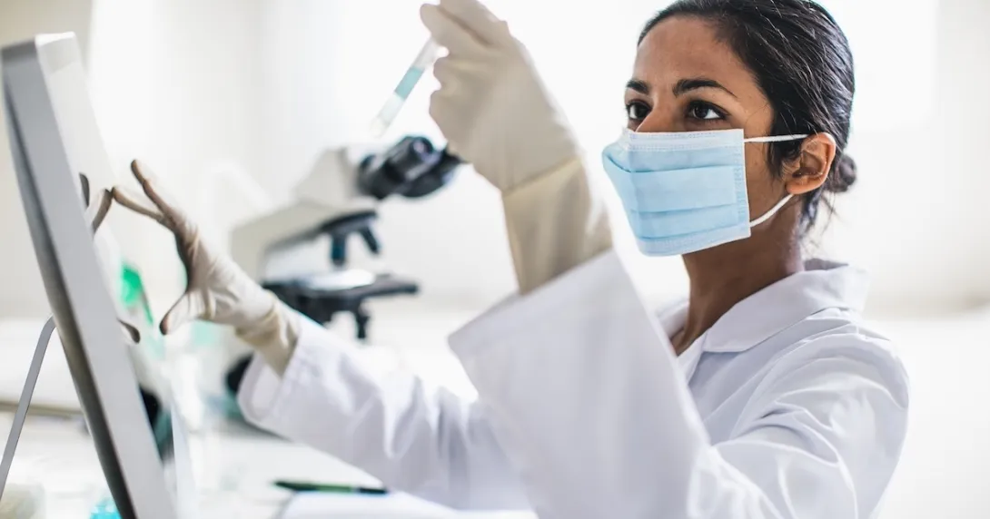 Technician working in a lab Technician working in a lab