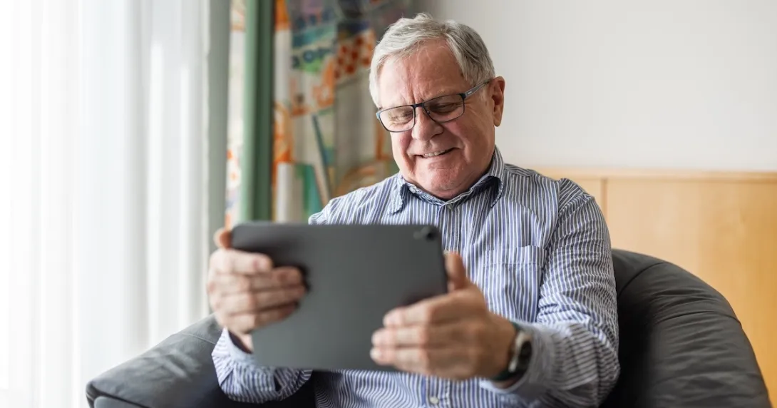 Senior patient looking at a tablet Senior patient looking at a tablet