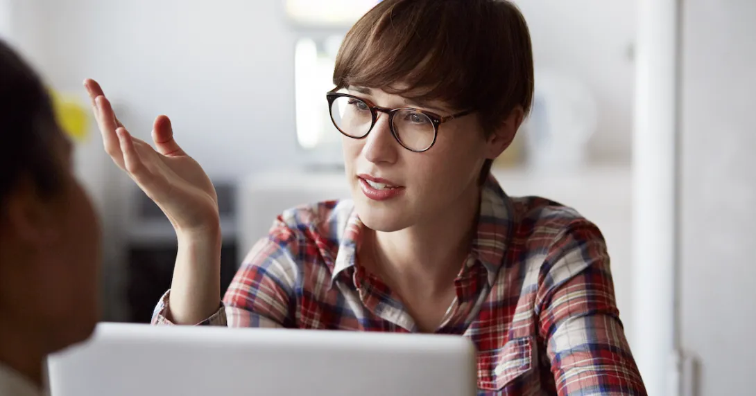 
  Person at a computer talking
