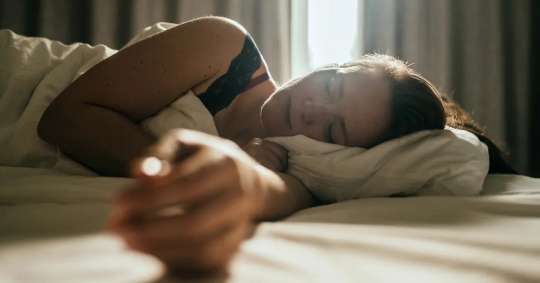 Someone sleeping in a bed