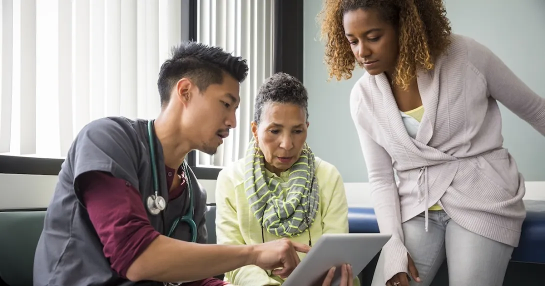 Physician consulting with a patient and family member