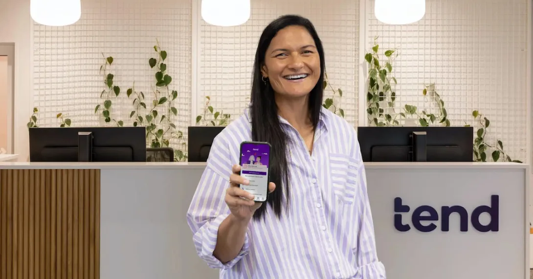 
  Olympian Valeria Adams showing the Tend Health app 
