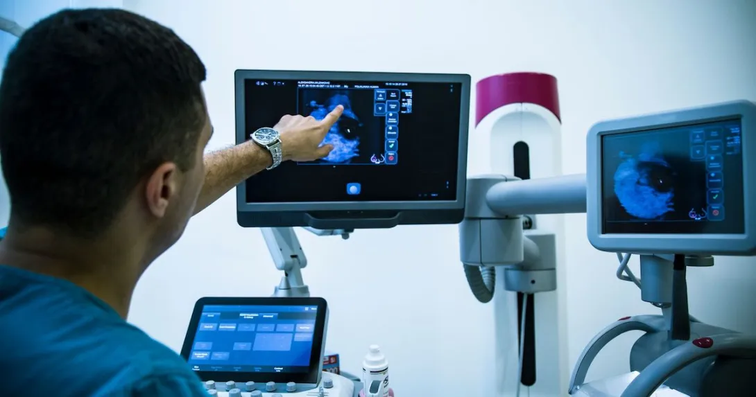 
  A doctor looking at a mammogram. 
