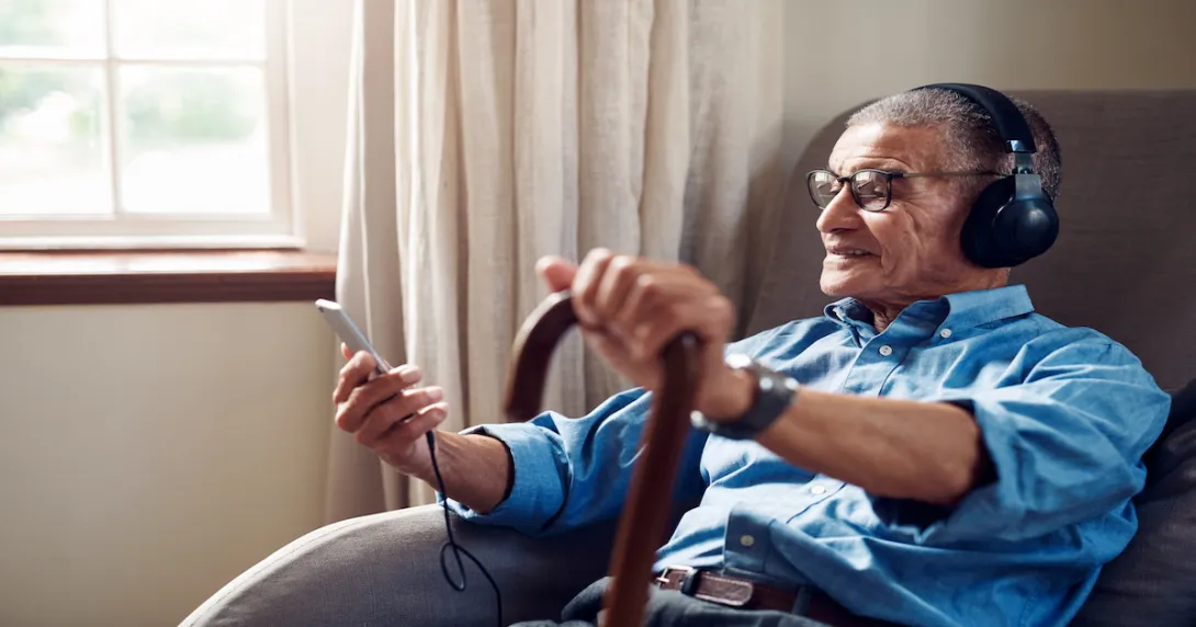 A person wearing headphones, using a smartphone and wearing a watch in the home
A person wearing headphones, using a smartphone and wearing a watch in the home