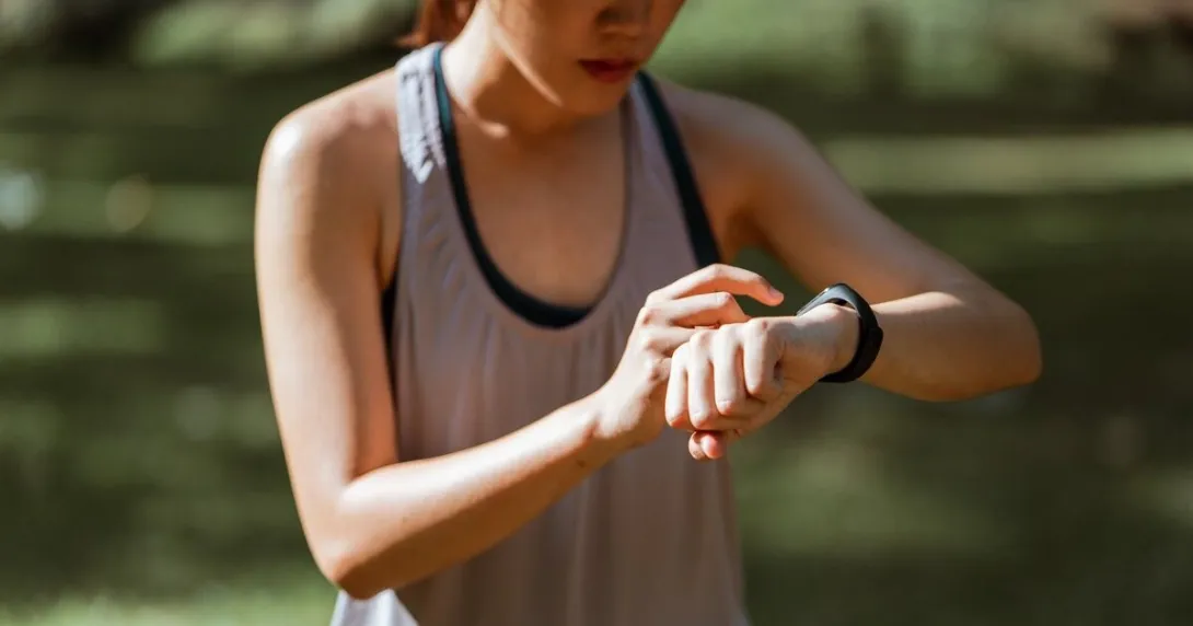 
  A person checking their fitness tracker
