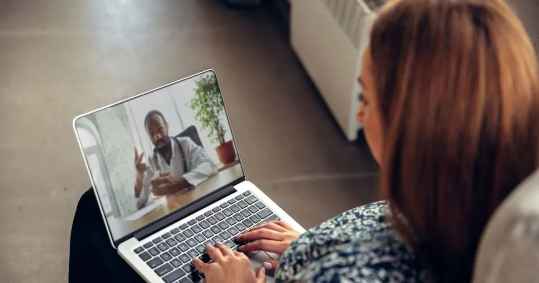 Person talking with provider on laptop Person talking with provider on laptop