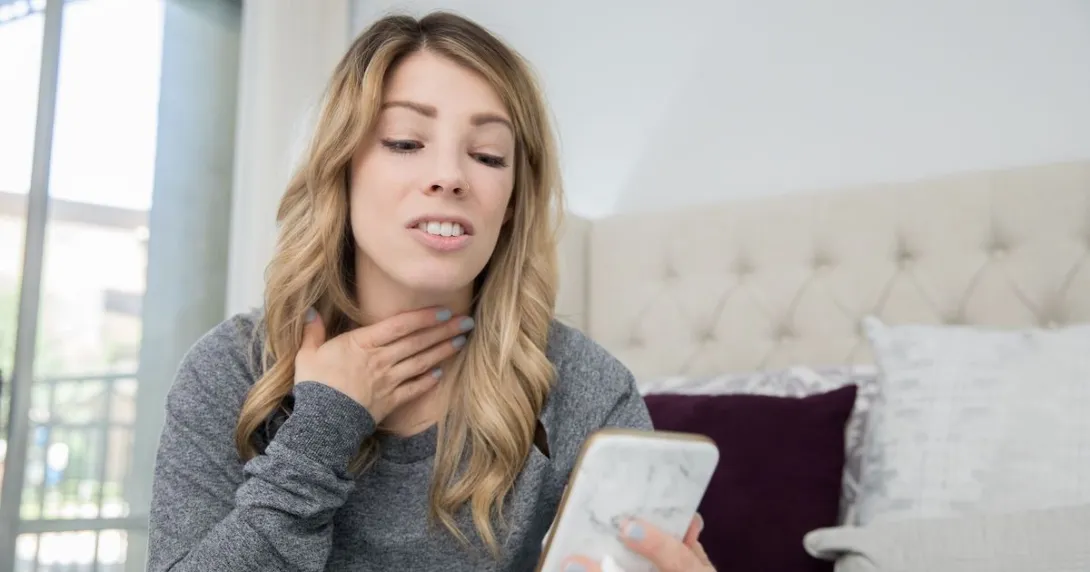 
  A person talking on a video chat on a phone about a sore throat
