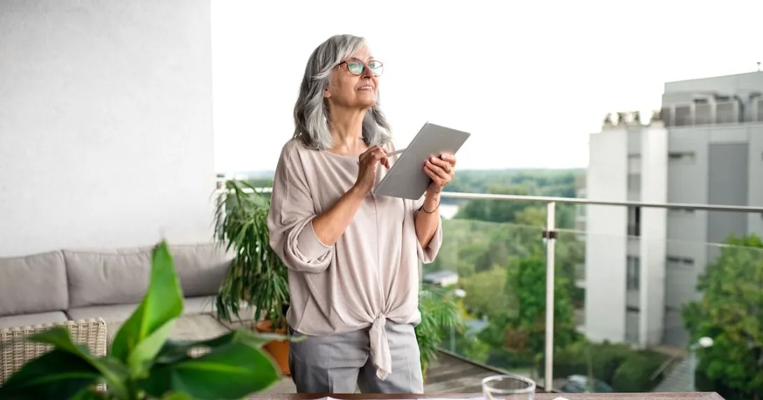 An older woman using a tablet