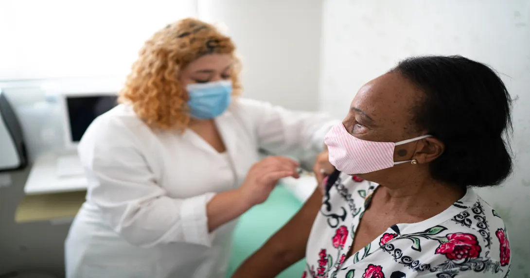 A healthcare provider administering a vaccine.